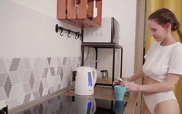 Russian cutie with natural tits masturbates in the kitchen